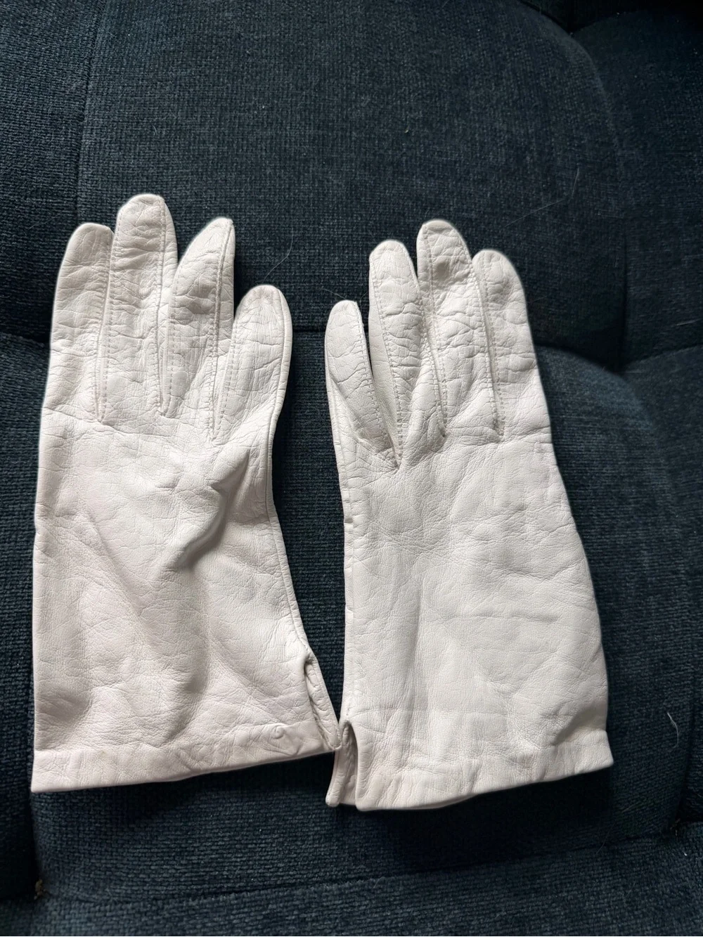 Classic Women’s White Leather Gloves. Brand is Miss Ari’s.